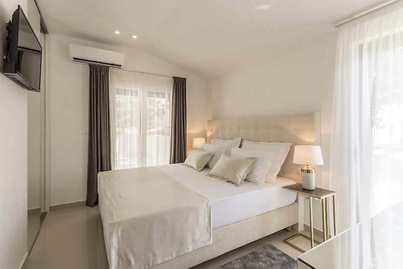 Bedroom No1 with king-size bed 180cm x 200cm, A/C, a TV, a balcony and a terrace
