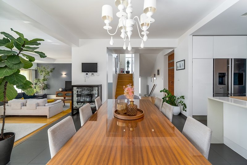 A kitchen island, and a stylish dining area