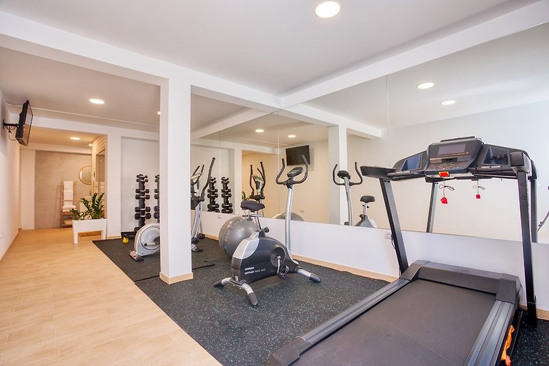 a Gym that offers Treadmill, Orbitrek, Exercise bike, pilates ball, weights and TV and Bluetooth surround system