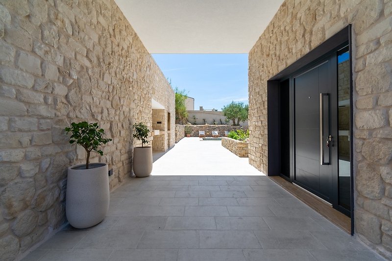 Typical Dalmatian surroundings like stone walls of the garden