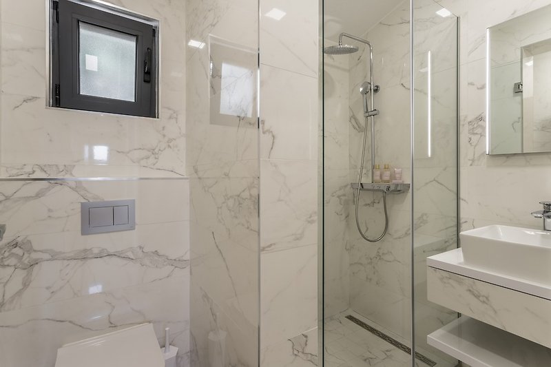 A spacious family bathroom No3 with shower, first floor