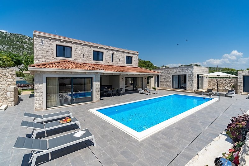 NEW! Stylish Villa Neven with 44sqm heated private pool, 4 en-suite bedrooms, 2 living and dining areas, playground