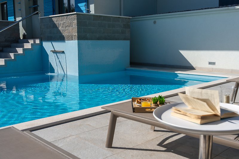 ...or relax at the heated private pool and enjoy the sunny days!