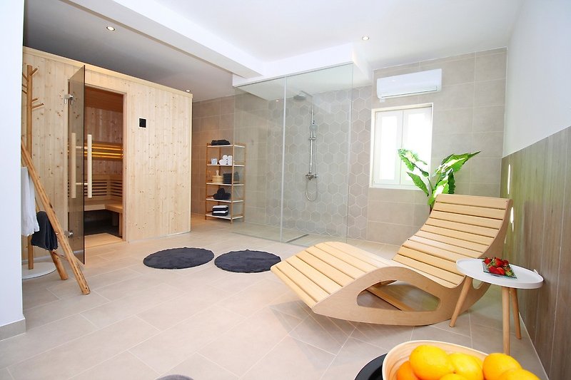 Relaxation room with sauna and shower, above the game room
