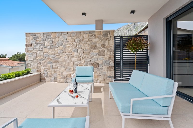 Villa Una bietet eine Lounge-Ecke vor der Küche