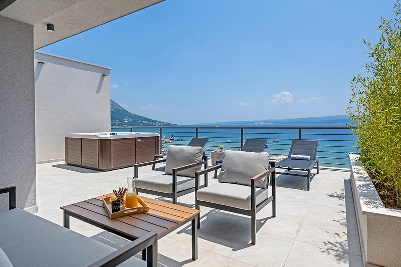 A spacious terrace (55 sqm) with spectacular sea views (approached by the indoor staircase)