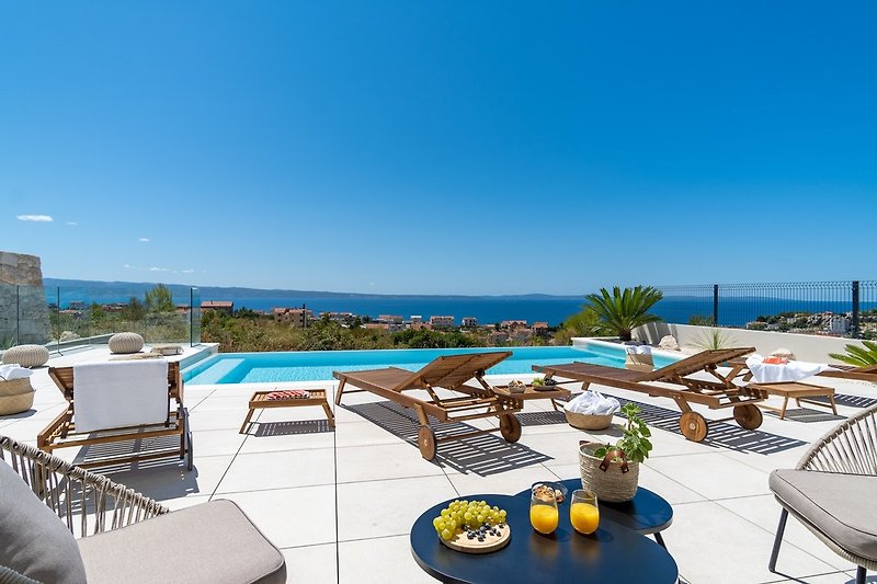 Villa is located in Podstrana above a coastal road in a very quiet area at the most beautiful part of the Dalmatian coast