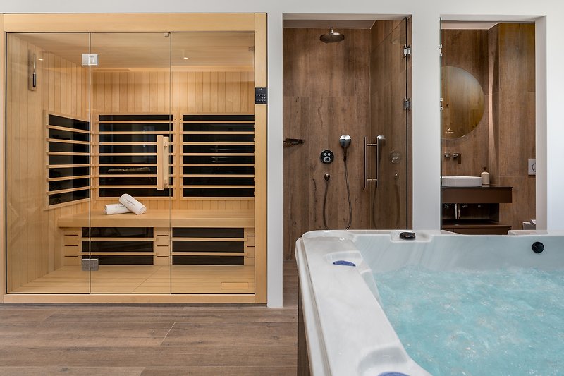 A luxurious bathroom with a stylish bathtub and elegant fixtures.