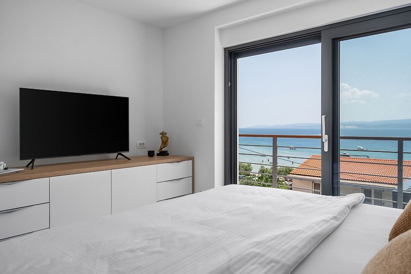 Master bedroom No1  with a terrace with sea and pool views.