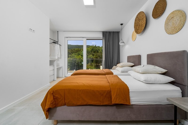The first-floor offers a Bedroom No2 with 2 single beds and balcony with pool view.