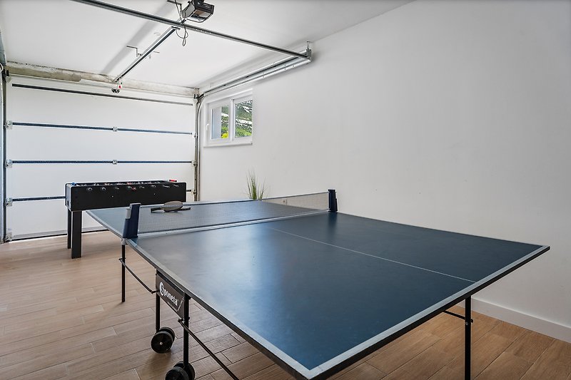 Separate fun area with table tennis and table soccer