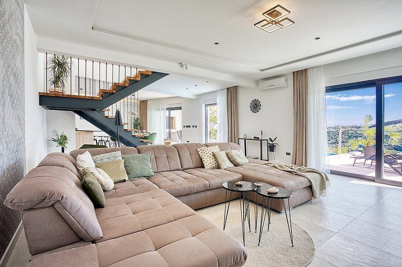 A spacious living room with a comfortable sofa