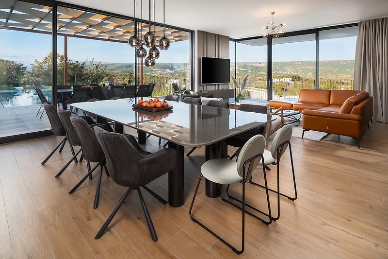 Main living/dining area with glass doors toward outdoors offering amazing views of the valley