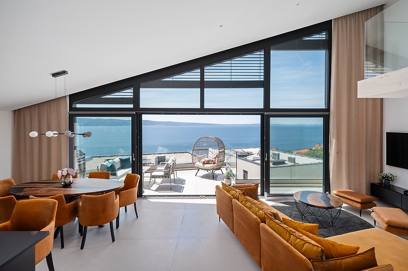 Large, elegantly designed living area with modern furnishings