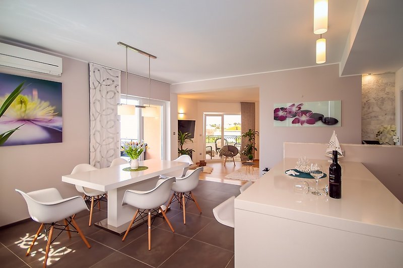 Fully equipped kitchen First floor dining area with balcony and sea views 