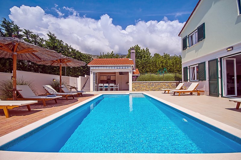 Private, heated pool  8m * 3,5m and fully equipped summer kitchen with TV