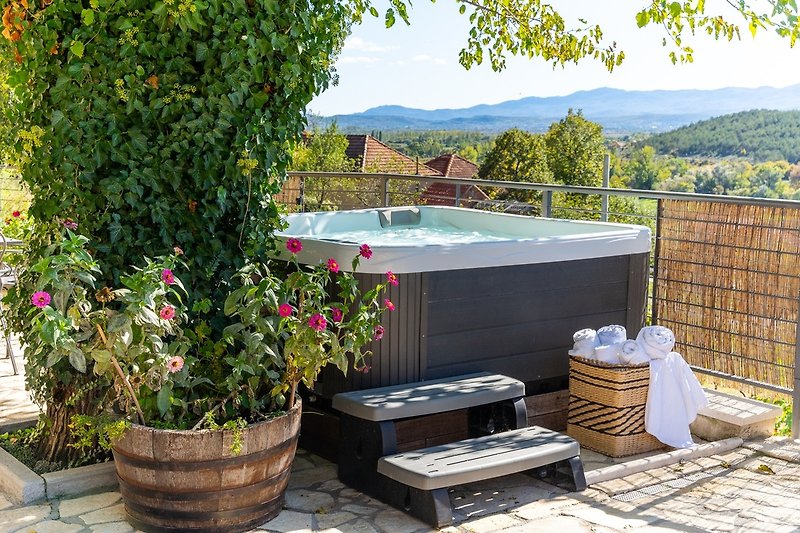 The outdoor offers  Hot-tub for adorable relax