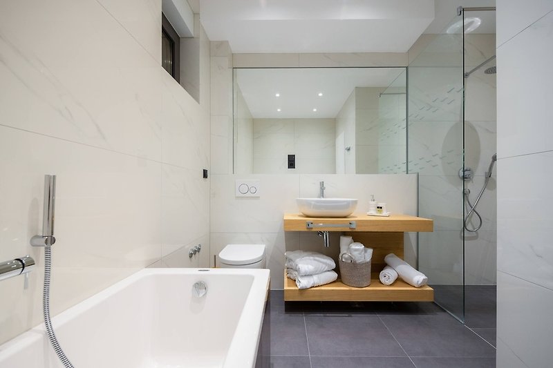En-suite bathroom with bathtub and shower in Bedroom No4, ground floor