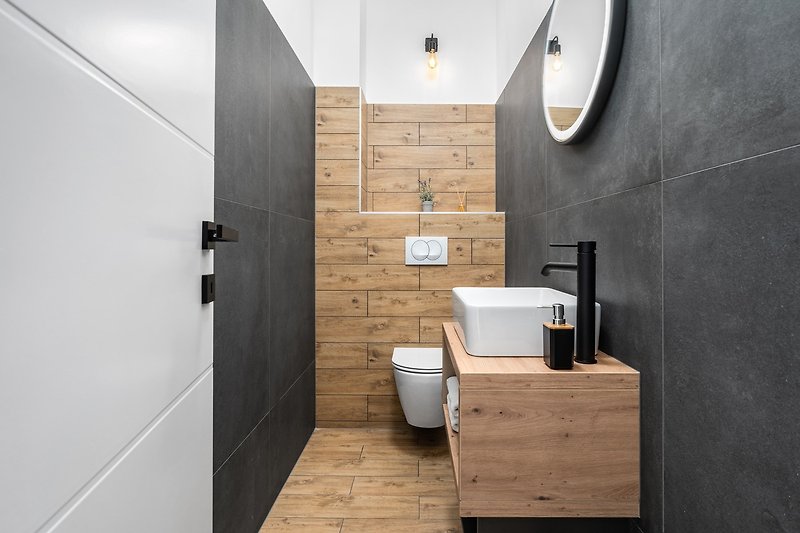 Rent this stylish bathroom with a modern design and luxurious fixtures.
