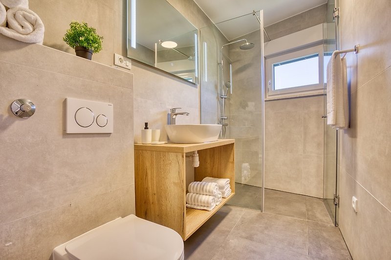 a Family bathroom with a shower