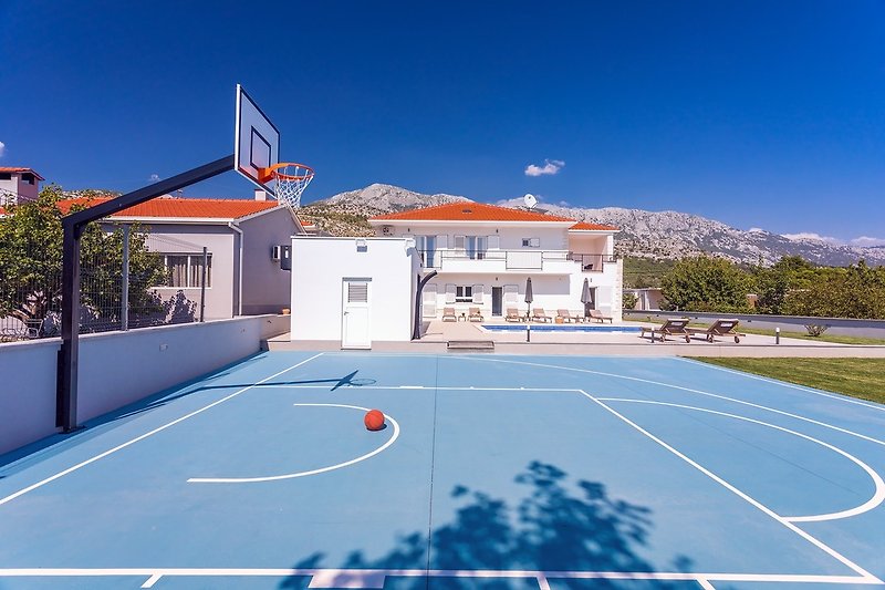 A huge playground that offers various activities like basketball, football or volleyball
