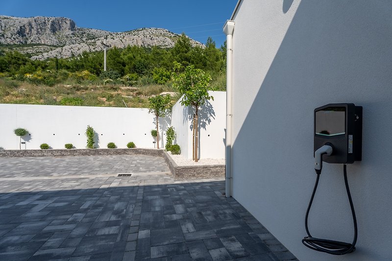 Villa Nina offeres a charger for electirc car .