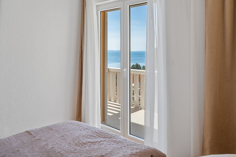 Bedroom No.2 with king-size bed and exit to the balcony, sea view, 1st floor