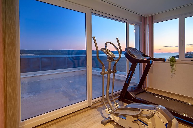 Gym on the last floor of the house with sea view