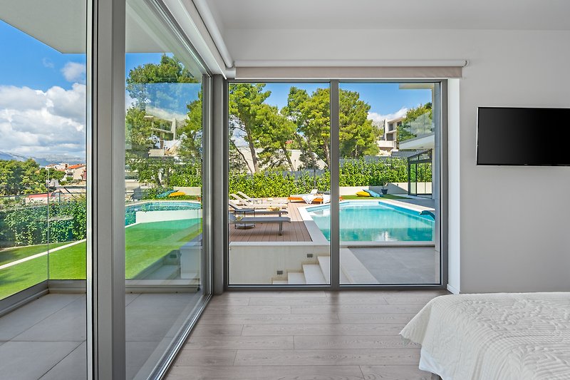 Stylish 5-bedroom villa Aride with heated pool, gym, pool table, sauna, sea views