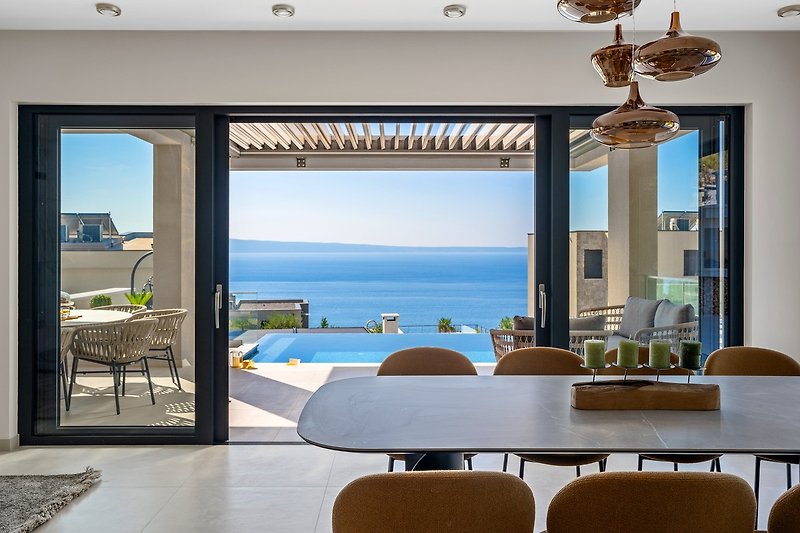 Living/dining area with sea views