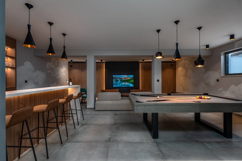 Well organized fun zone in the basement with billiards and a Media room with PS4