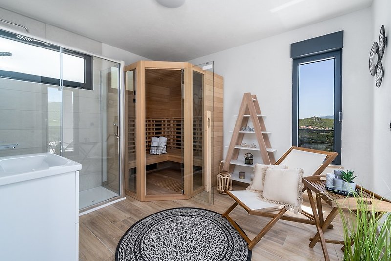 The Second floor is connected with an indoor staircase and offers an infrared Sauna room (13sqm)