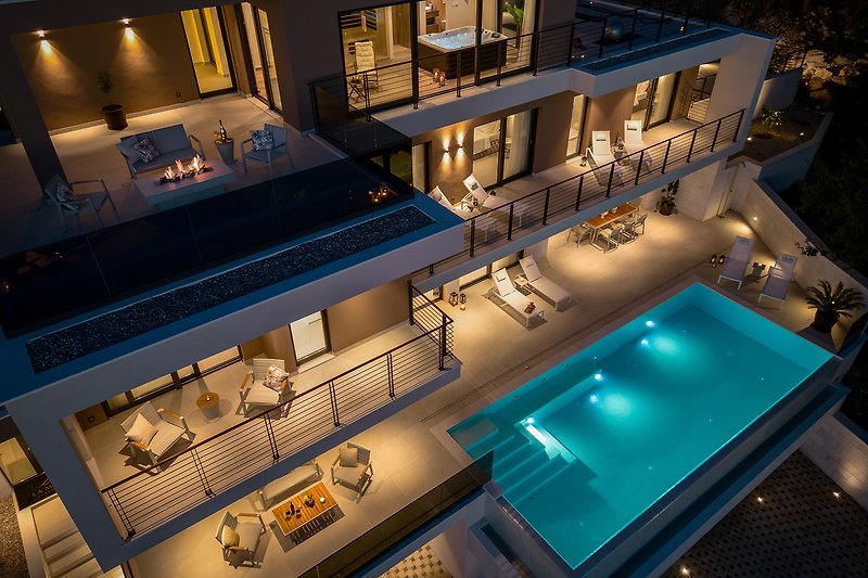 A luxurious apartment with a stunning swimming pool and urban design.