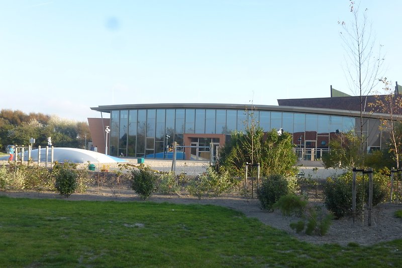 Central building with indoor and outdoor playground