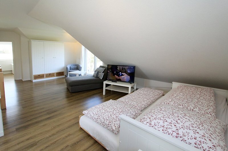 Loungebereich mit ausziehbarem Bett