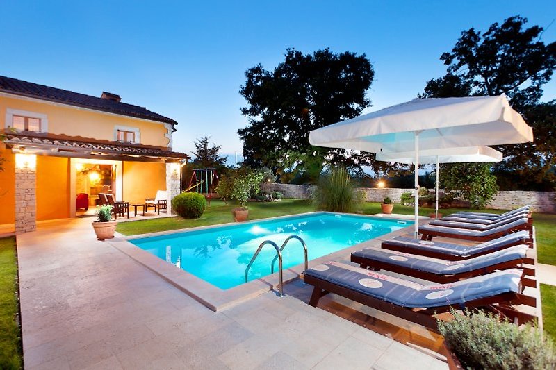 Pool lighting creates a magical outdoor environment