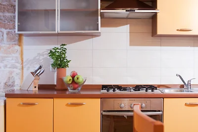 Zona pranzo e cucina completamente attrezzata Zona pranzo e cucina completamente attrezzata