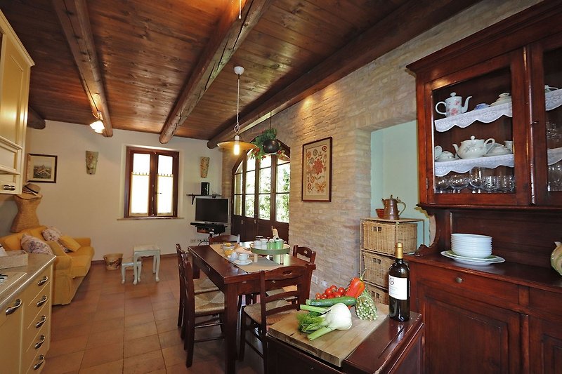 Casa Polly - Blick auf die Küche, Essbereich und Wohnzimmer mit Sofa