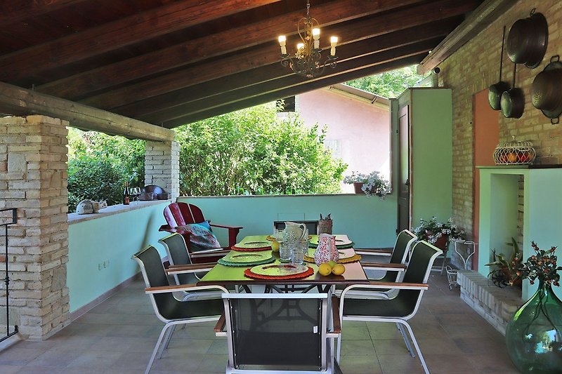 Casa Polly - Porch equipped with table and chairs