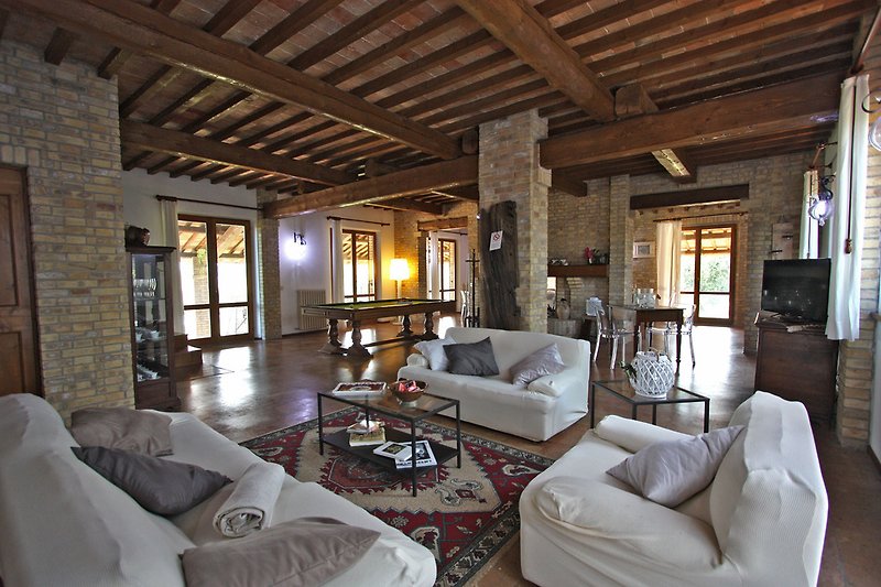 Villa Monica - Wide living room with sitting area, fireplace and pool table