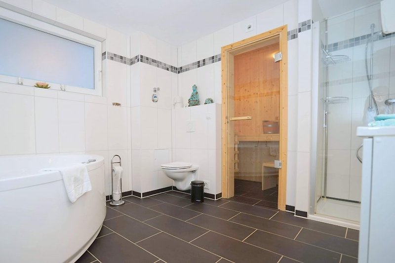 Bathroom with whirlpool and sauna