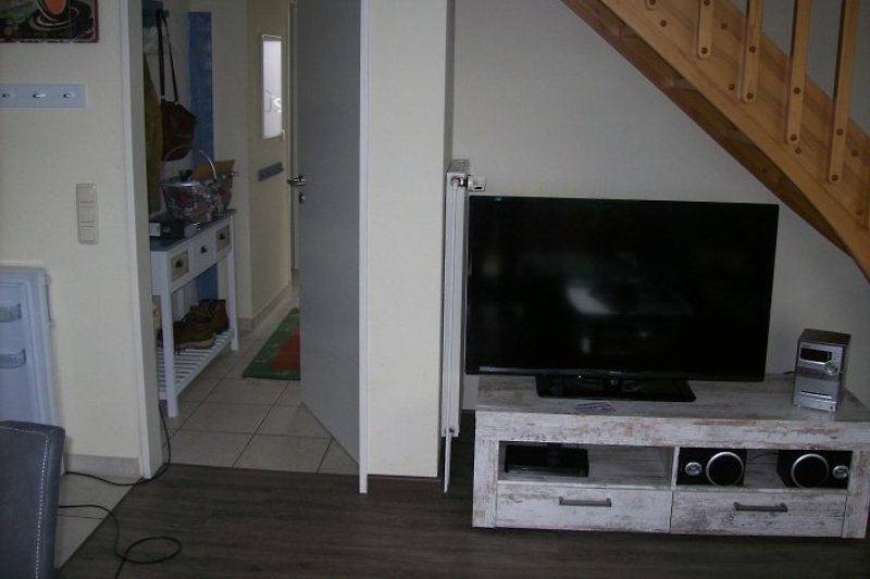 Large TV, DVD player, and stereo system.