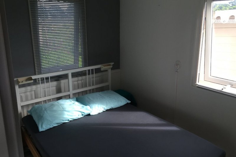 Slaapkamer met 2-persoonsbed