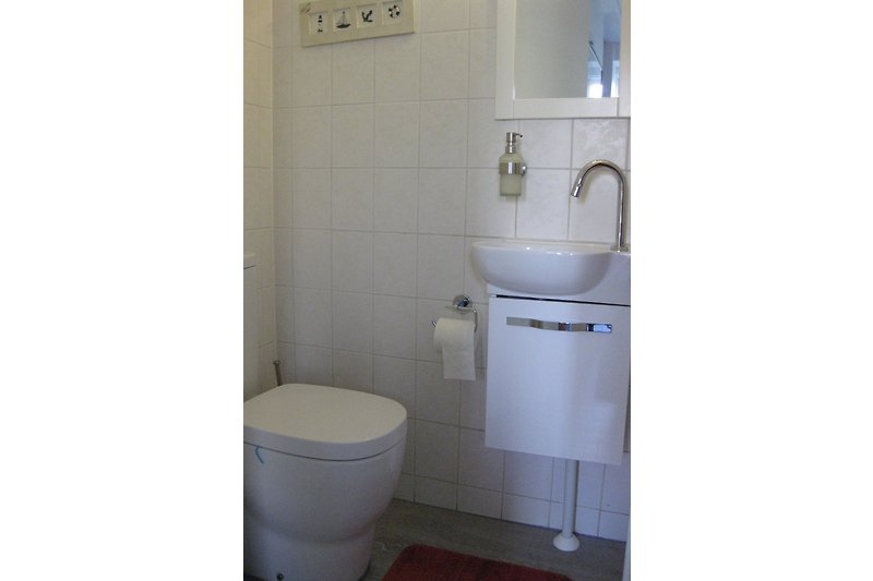 Separate toilet on the ground floor next to the bedroom.