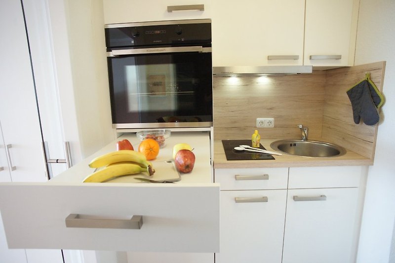 Kitchen with integrated work surface