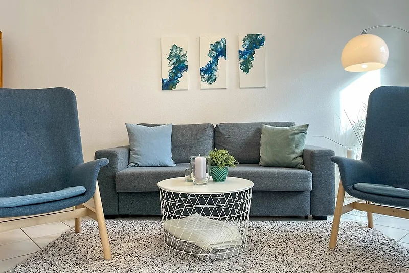 Wohnzimmer mit Schlafsofa