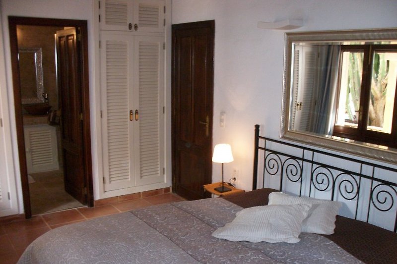 Large bedroom with door to the garden.