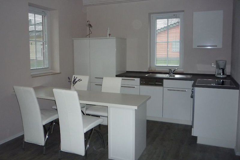 Dining area with fitted kitchen