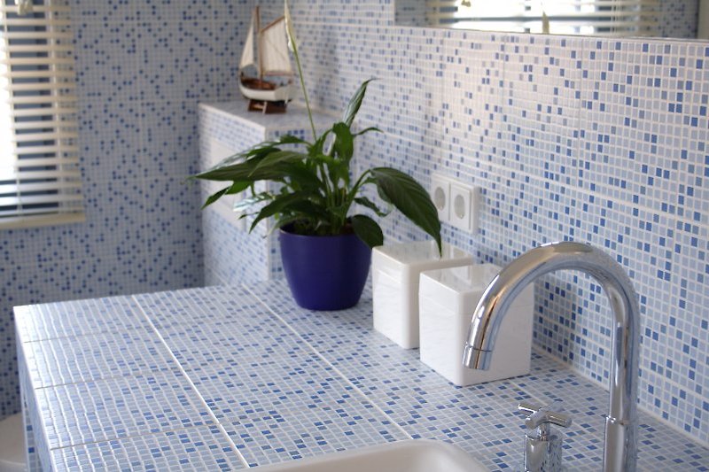 The modern designed bathroom with a maritime ambiance