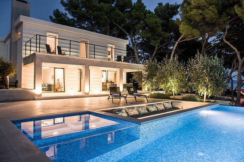 Luxurious villa with swimming pool and landscaped garden.